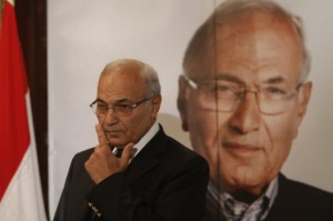 Former presidential hopeful Ahmed Shafik addresses a news conference on 3 June saying, "No one will be detained for their opinion... Security services will be committed to the law and to human rights standards" PHOTO/AFP