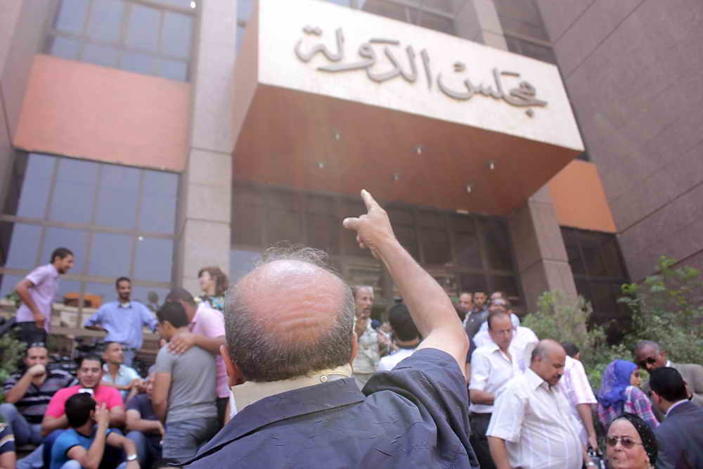 Protesters outside the Administrative court in Cairo wait for a Court ruling on the panel of Judges designated to decide on the legitimacy of the constitutional committee on 30 July in Cairo (photo: The Daily News Egypt/ Mohamed Omar)