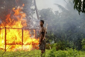 A Rohingya Muslim village burns in recent violence in Myanmar