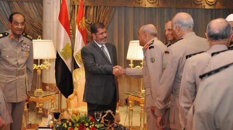 This handout picture released by the Egyptian presidency shows Egyptian President Mohamed Mursi (C) meeting with Field Marshal Hussein Tantawi (L), Egyptian Armed Forces Chief Of Staff Sami Anan (2nd R) and members of the Egyptian Supreme Council of Armed forces ahead of an Iftar meal ceremony at the Al-Jalaa military club in Cairo on July 29, 2012 (photo: AFP /HO/EGYPTIAN PRESIDENCY)