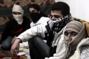 Syrian refugees from Damascus sit in a flat in Amman (AFP/Khalil Mazraawi)