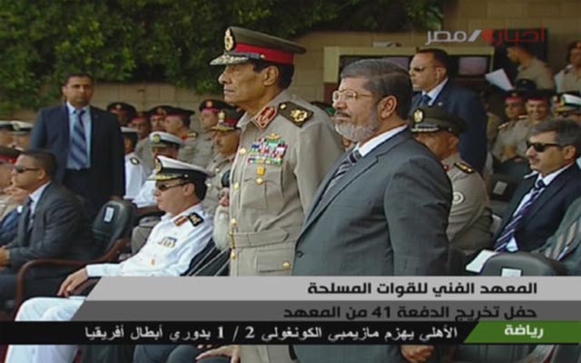 President Mohamed Morsy shared a dais with the two heads of the Supreme Council of Armed Forces at the graduation ceremony for the Military Technical College