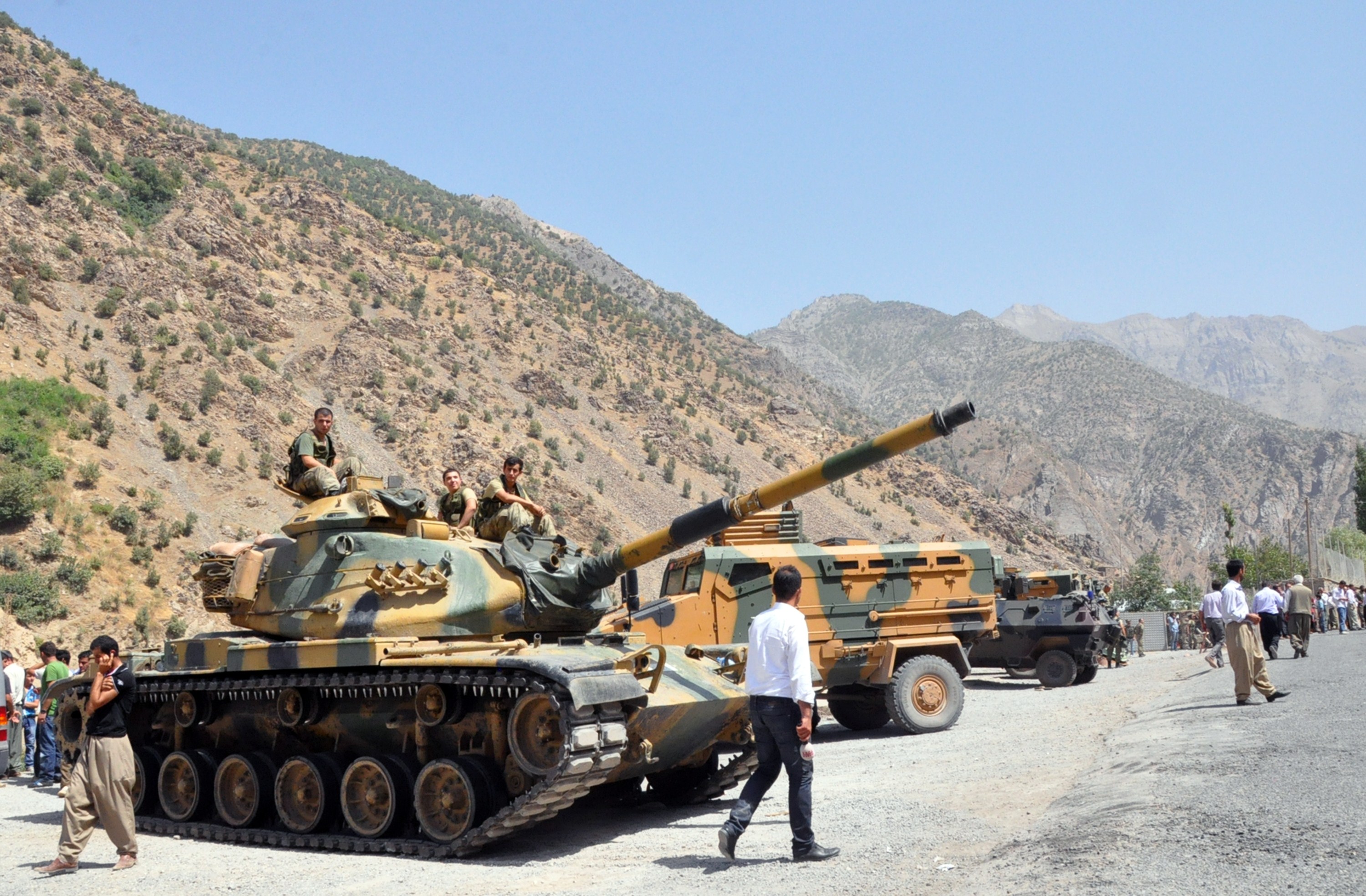 Heavy armoured vehicles of Turkish military are stationed in front of Gecimli military outpost where Kurdish rebels attacked and killed 6 soldiers and 2 village guard on 5 August AFP PHOTO/STR
