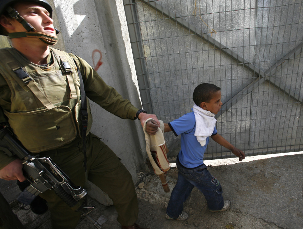 Soldiers who served in the Israeli Army between 2005 and 2011 have discussed their treatment of Palestinians in a 72 page report released by an organisation called Breaking the Silence on Sunday (File photo) AFP PHOTO / GALI TIBBON