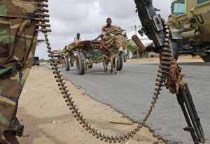 A Somalia transitional federal soldier stands guard during a visit of Somalia's President to Afgoye on July 30, 2012. The head of Somalia's corruption-riddled government said on July 23 he expects to be re-selected as president of the war-torn Horn of Africa nation when his current mandate expires next month. "I am a strong candidate and I am very confident that I will win," President Sharif Sheikh Ahmed told reporters last week. AFP PHOTO / Mohamed Abdiwahab