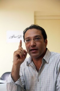 Islam Afifi, editor of Egyptian El-Dostour newspaper, gesturing during a meeting at the newspaper's offices in Cairo on 13 August AFP PHOTO/STR