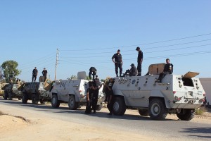 Egyptian security forces stand by their Armoured Personell Carriers ahead of a military operation in the northern Sinai peninsula on 8 August AFP PHOTO / STRINGER