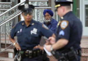 Police increase their presence at the Sikh Cultural Center in Richmond Hill Queens in New York on 6 August 6. The extra security is in response to a shooting the at the Sikh Temple of Wisconsin in Oak Creek Wisconsin on 5 August that left seen people including the suspected shooter dead and three injured AFP PHOTO/ Mehdi Taamallah