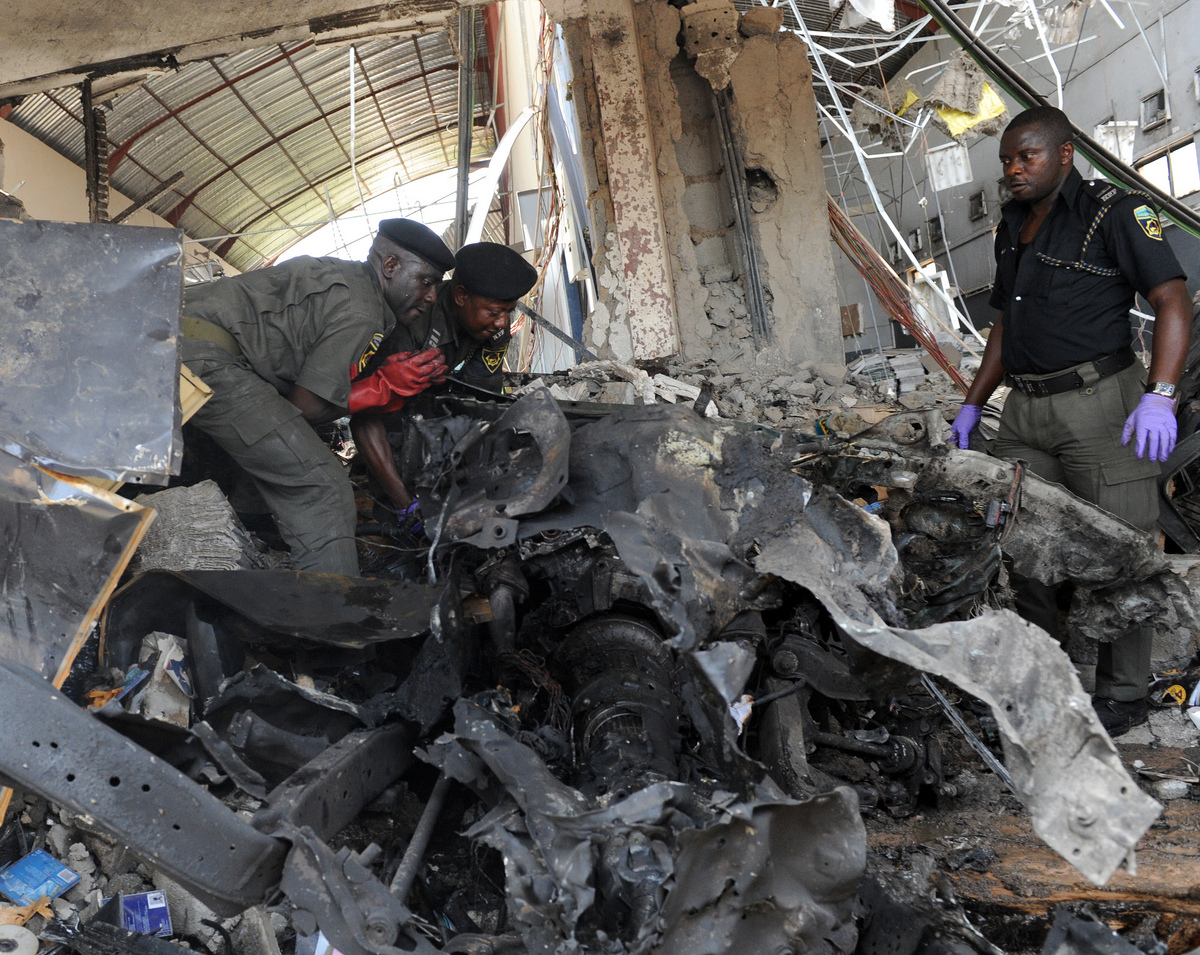 Bomb squad police work at the office of This Day newspaper, the radical sect Boko Haram said it carried out the attacks (File photo) AFP PHOTO / PIUS UTOMI EKPEI