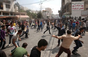 Palestinian protesters throw stones at police attempting to control the streets surrounding the municipality in the southern city of Hebron on 10 September after demonstrators hurled stones at the building AFP PHOTO / HAZEM BADER