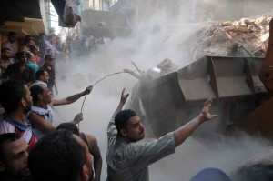 Workers begin to clear the rubble from the collapsed apartment building in the Shubra district of Cairo Mohamed Omar