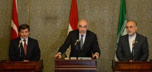 Egyptian Foreign Minister Mohammed Kamel Amr (centre), Iranian Foreign Minister Ali Akbar Salehi (right), and Turkish Foreign Minister Ahmet Davutoglu attend a joint press conference after their first high-level meeting on the Syria conflict in Cairo AFP PHOTO / KHALED DESOUKI