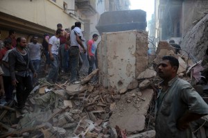 Rescuers try to clear the debris from a recent building collapse in the Shubra area of Cairo (File photo) Mohamed Omar