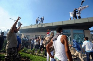 Tunisian protesters break into the US embassy in Tunis during a protest against a film mocking Islam on 14 September AFP PHOTO / FETHI BELAID