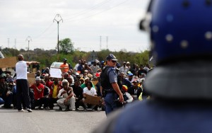 South African police block a march by protesting miners in Rustenburg after a security crackdown in the restive platinum belt AFP PHOTO / ALEXANDER JOE