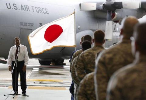 US Defense Secretary Leon Panetta listens to a question from a US military personnel stationed at the Yokota air base in Tokyo, on September 17. Panetta's trip to Asia coincides with an emotionally charged feud between Beijing and Tokyo over disputed islands in the East China Sea, with thousands of Chinese demonstrating against Japan over the weekend AFP Photo
