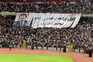 Crowds fill Cairo stadium to witness President Morsyâs speech on the anniversary of the 6 October War. The banner reads âFirst civilian president after Octoberâs victoryâ Mohamed Omar