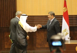 President Morsy greets a Sinai sheikh during his visit to Al-Arish Nasser Elazazy