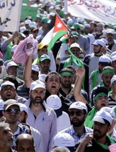 Jordanian protestors take part in a demonstration in Amman AFP PHOTO / KHALIL MAZRAAWI