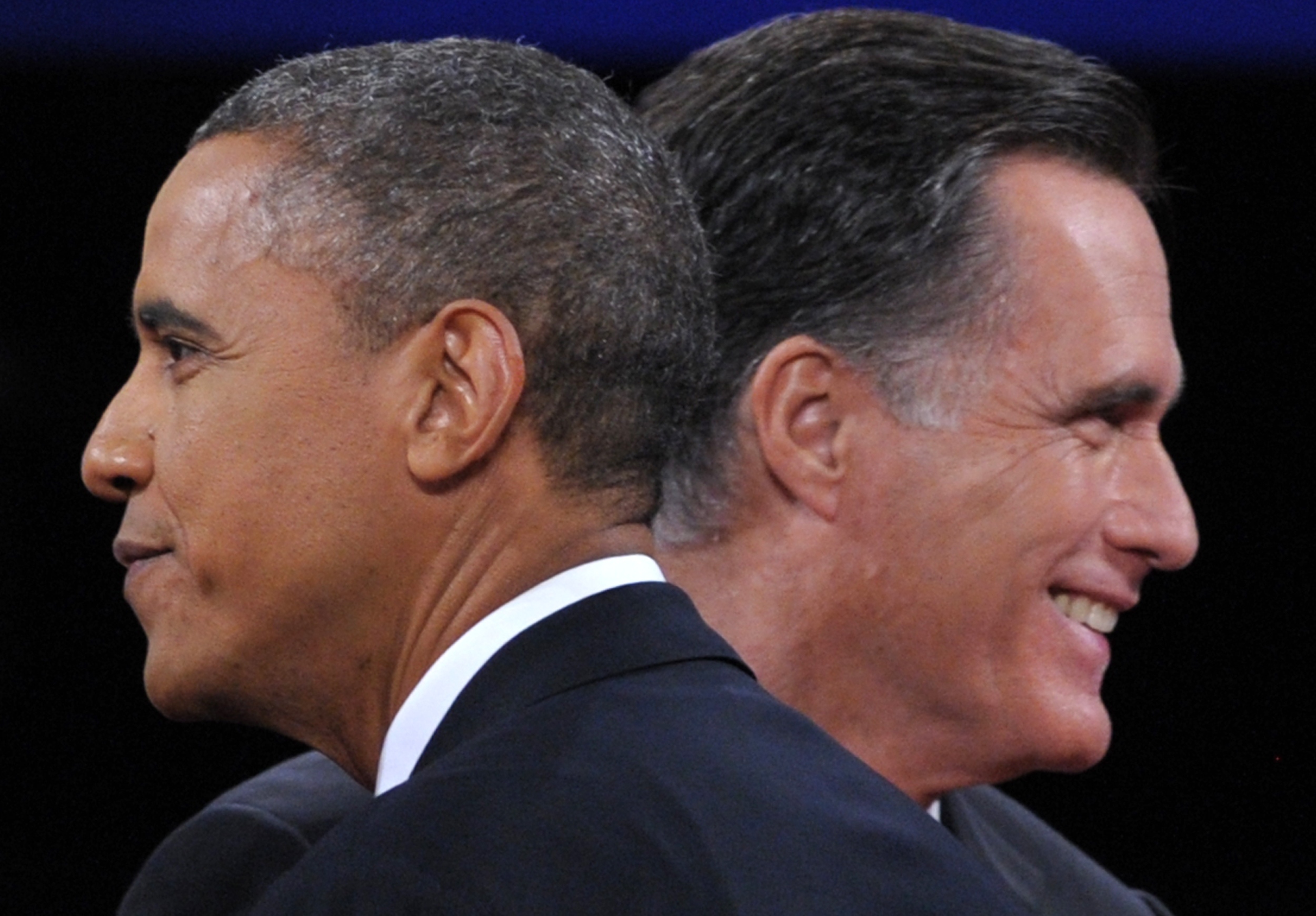 US President Barack Obama greets Republican presidential candidate Mitt Romney following the third and final presidential debate at Lynn University in Florida. AFP PHOTO / SAUL LOEB