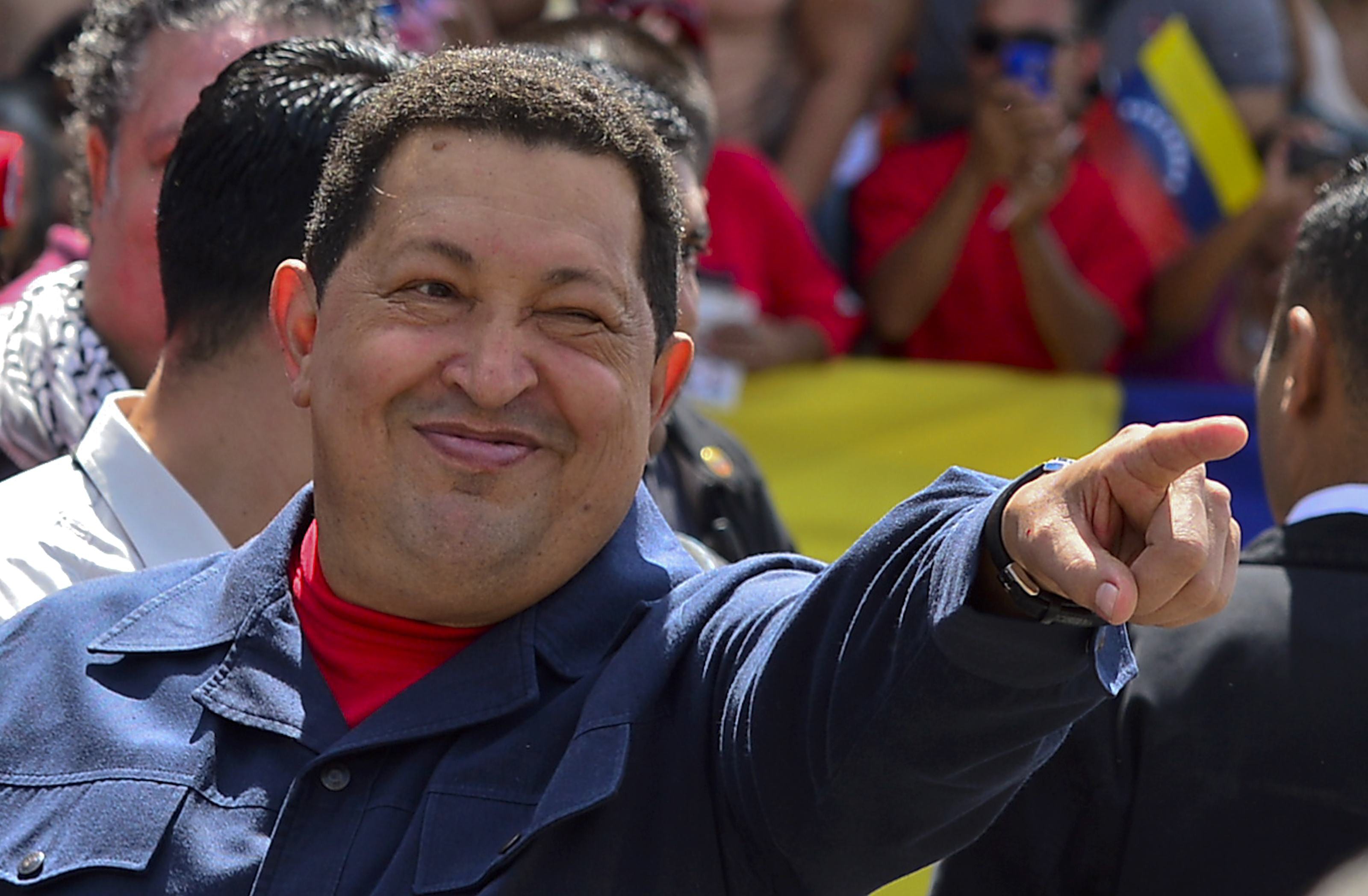 Venezuelan President Hugo Chavez gestures before voting in Caracas AFP PHOTO / LUIS ACOSTA