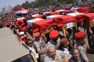 Funeral takes place in Cairo for the soldiers killed by gunmen near the border with Israel at Rafah. After this attack Morsy sacked several head figures in North Sinai and retired Hussein Tantawi, defence minister at the time Mohamed Omar