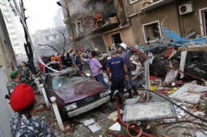 Lebanese security forces and rescue workers gather at the site of an explosion that killed intelligence chief Wissam al-Hassan. (Chady Souaid / AFP / Getty Images)