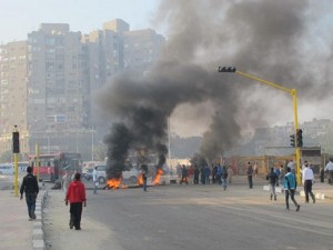 Angry residents set fire to tyres in order to block the passage of military police. (Photo via Mohamed Abla's Facebook page)