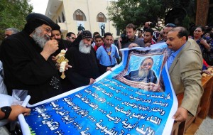 Worshippers present Bishop Tawadros with a new banner celebrating his ascension to the papacy Hassan Ibrahim