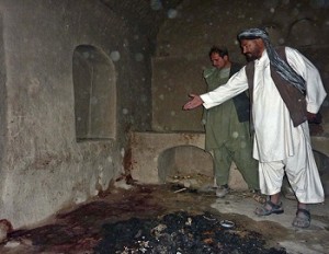 In this picture from March, an Afghan villager points to a spot where a family was shot, allegedly by US soldier Staff Sergeant Robert Bale. (AFP / FILE PHOTO / MAMOON DURRANI)