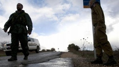 Israeli soldiers stand guard in Alonei Habashan in the Israeli-occupied Golan Heights, on November 11, 2012. (AFP PHOTO / JALAA MAREY)