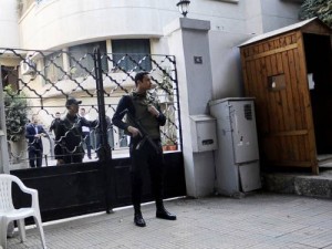 Secruity forces stand outside one of the NGOs (AFP Photo)