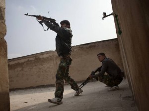 Rebel fighters fire against Syrian government forces in the Bab el-Adid district in Aleppo on 23 October.(AFP PHOTO / GETTY IMAGES / Fabio Bucciarelli)