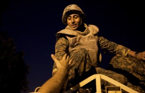 An Egyptian anti-government demonstrator extends his hand to a soldier in Tahrir Square after President Hosni Mubarak stepped down on 11 February (AFP Photo / Marco Longari)