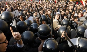 Demonstrators clash with police in central Cairo during a protest to demand the ouster of President Hosni Mubarak and calling for reforms on 25 January (AFP Photo / Mohammed Abed)