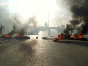 Families of prisoners in Sinai blocked off the Al-Arish central Sinai road in southern al-Arish, preventing night shift workers from arriving at cement factories in the centre of the peninsula. ( Photo by Nasser El-Azzazy)