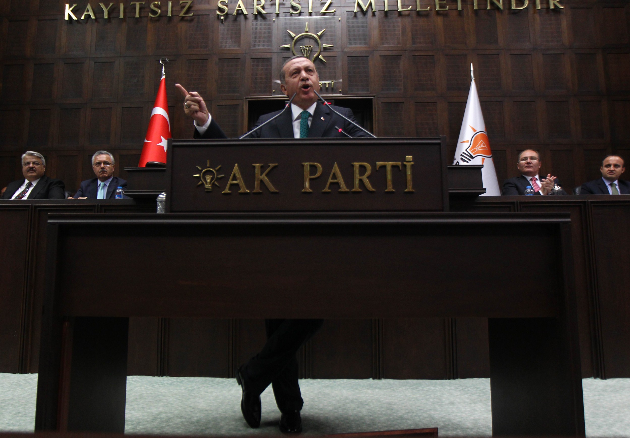 Turkey's Prime Minister Recep Tayyip Erdogan addresses members of the parliament of his ruling AK Party (AKP) during a meeting at the Turkish Parliament in Ankara on June 24, 2014. (AFP PHOTO/ADEM ALTAN)