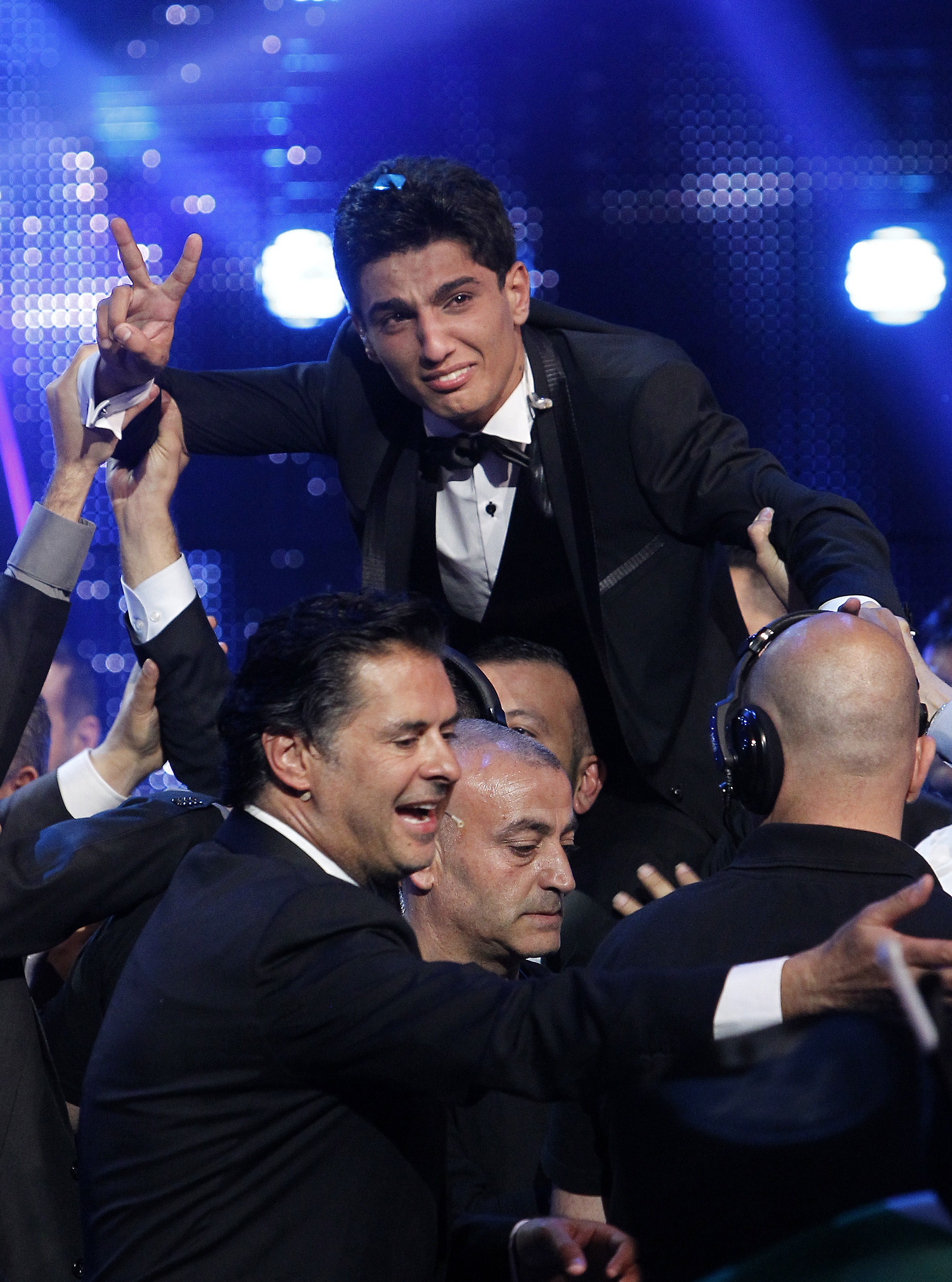 Palestinian singer Mohammed Assaf cries of joy as he celebrates after winning the "Arab Idol" singing contest in Zouk Mosbeh, north of the Lebanese capital Beirut, early on June 23, 2013 (AFP Photo)