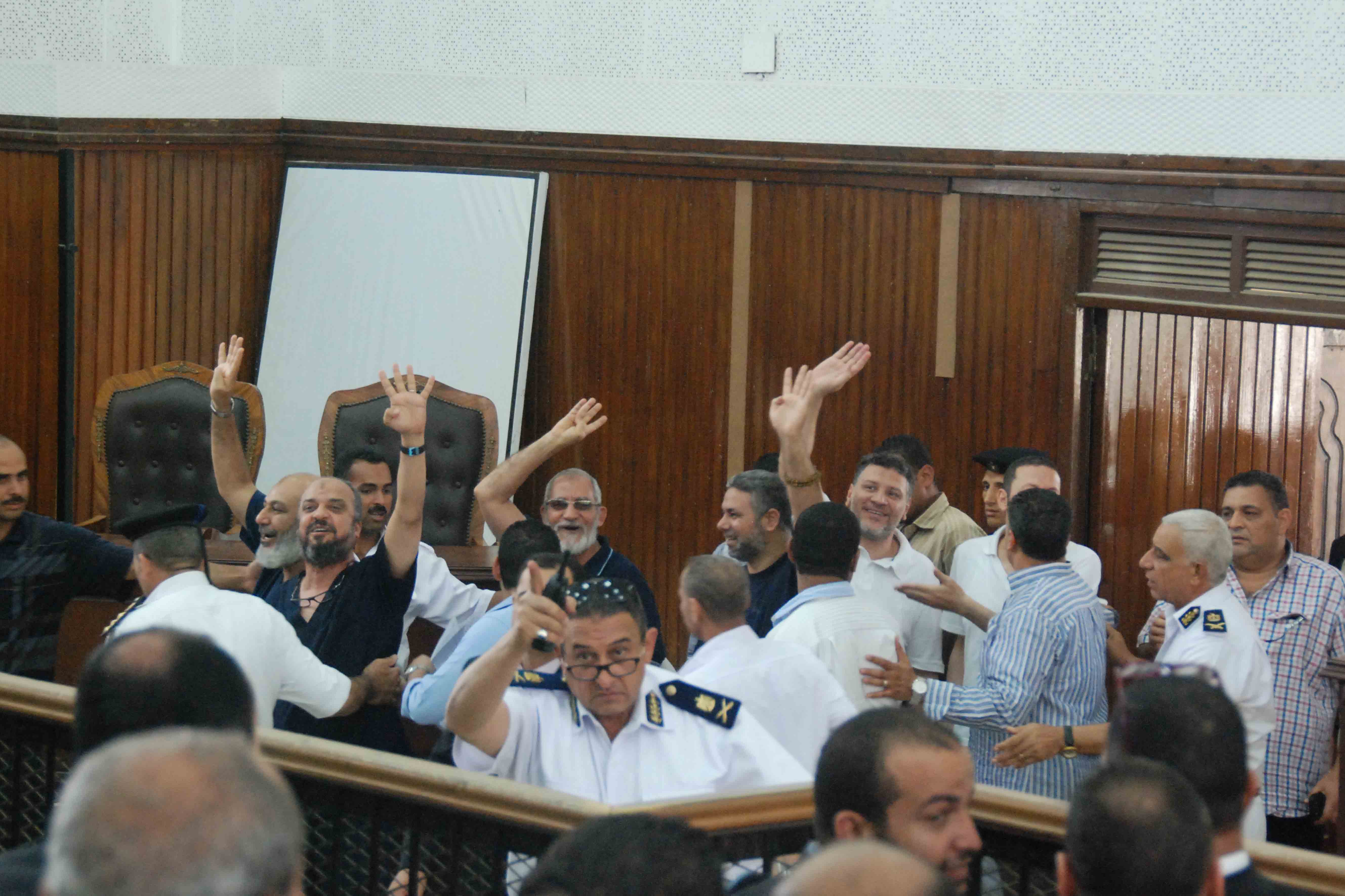 Supreme Guide of the Muslim Brotherhood Mohamed Badie, senior FJP member Mohamed AL-Beltagy, conservative preacher Safwat Hegazy, and other defendants arrive to court on Saturday. (Photo by Ahmed Al-Malky)