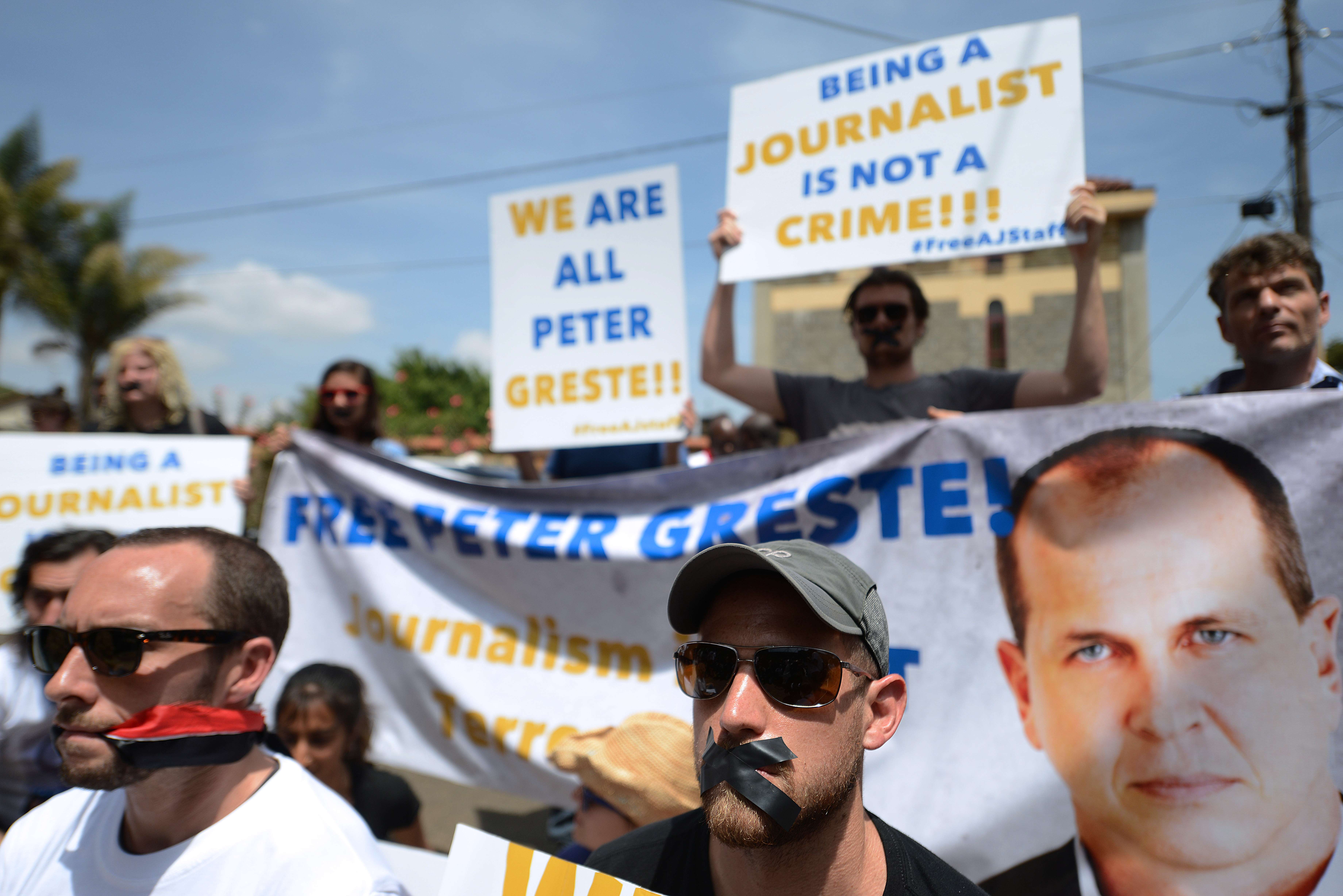 Journalists demonstrate in Nairobi for the release of Al Jazeera journalists in Egypt, as they march to the Egyptian Embassy in Nairobi, on 4 February (AFP PHOTO/SIMON MAINA)