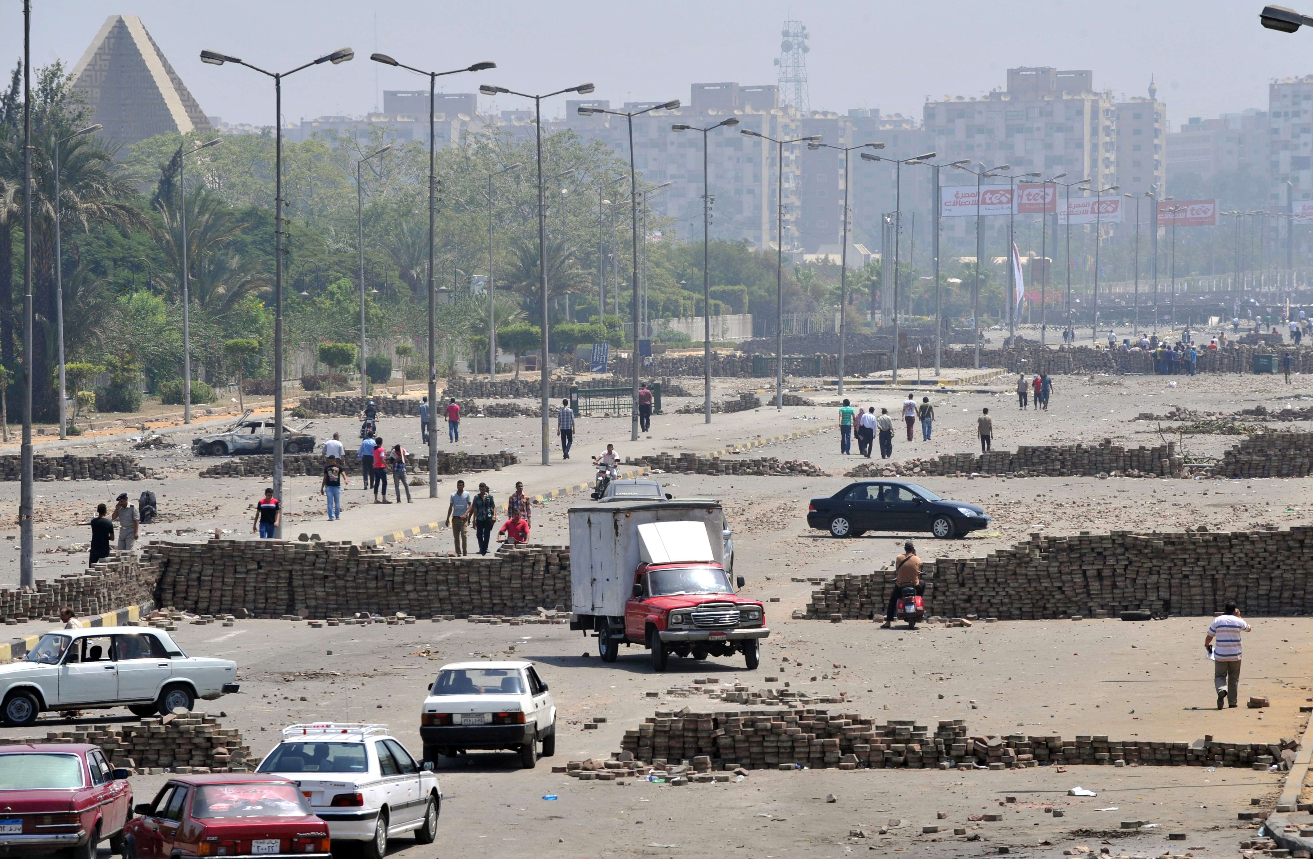 A general view shows brick barricades erected along Nasr City's main street, a district of eastern Cairo, on July 28, 2013, as supporters of deposed president Mohamed Morsi continue to hold a sit in outside Rabaa al-Adawiya mosque demanding his reinstatement. (AFP PHOTO/FAYEZ NURELDINE)
