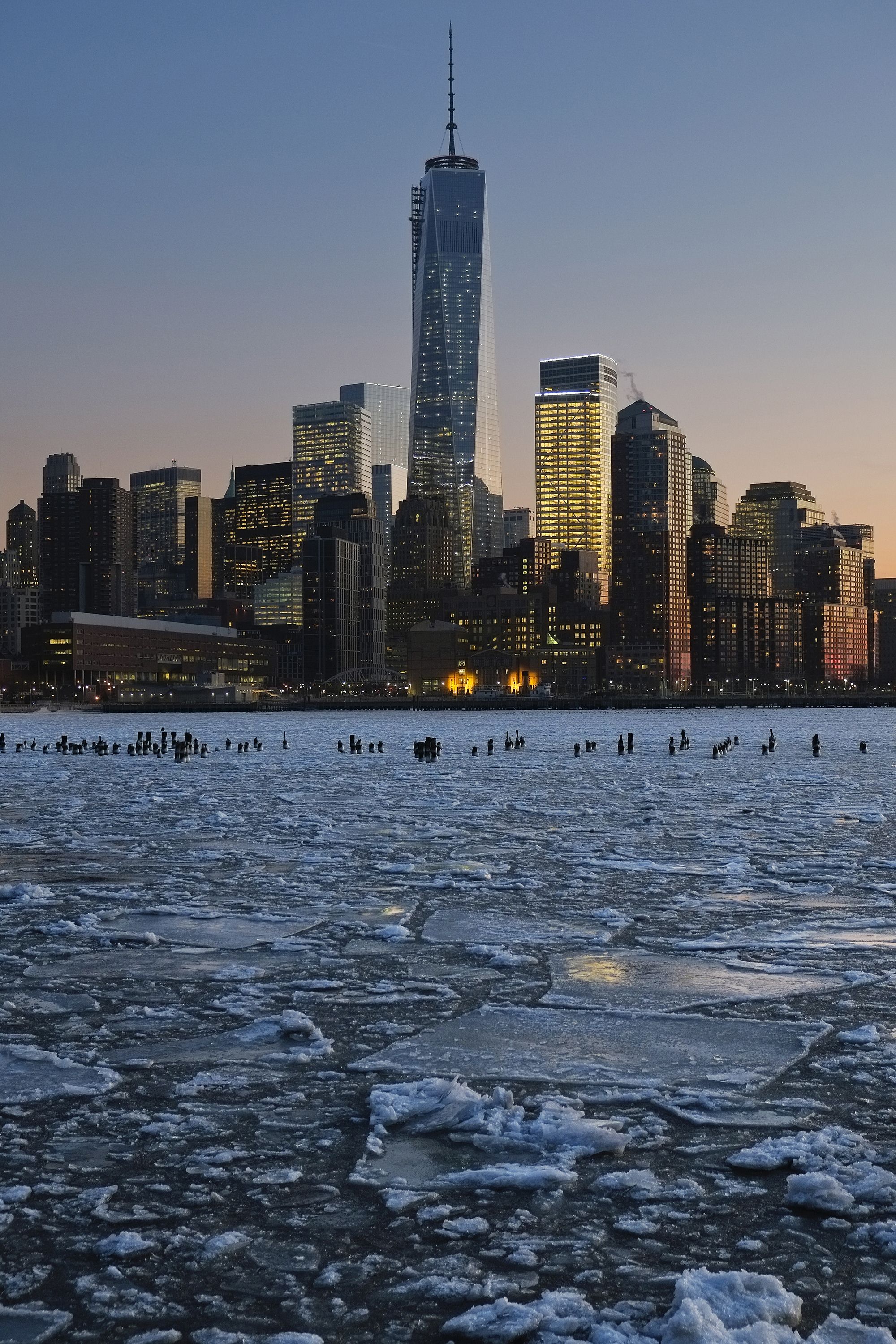 Ice floes fill the Hudson River as the Lower Manhattan skyline is seen during sunset on 9 January 2014 in New York City.A recent cold spell, caused by a polar vortex descending from the Arctic, caused the floes to form in the Hudson.