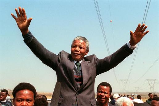 South African National Congress President Nelson Mandela addresses 05 September 1990 in Tokoza a crowd of residents from the Phola park squatter camp during his tour of townships. (AFP File Photo)