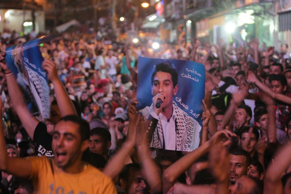 Thousands of Palestinians celebrate the victory in the Arab Idol contestant of Mohammed Assaf on Saturday night (AFP PHOTO/ABBAS MOMANI)