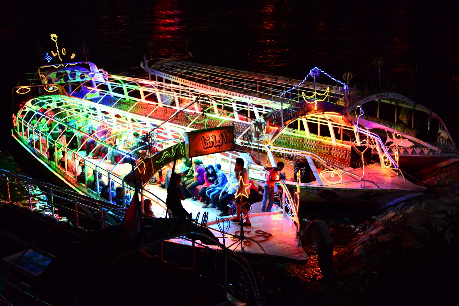 Groups of youngsters use to boats to glide along the water for an hour or two while listening to very loud music. (Photo by Aaron T. Rose)