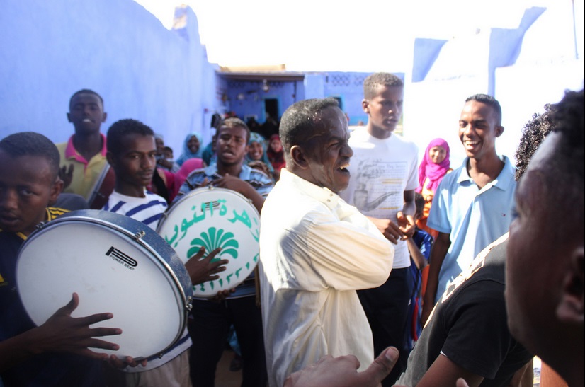 A group of men assemble and dance at the groomâs house (Photo by Aurora Ellis)