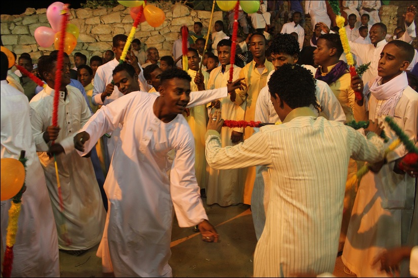 Nubian weddings are often feature colorful streamers, canes and flags (Photo by Aurora Ellis)