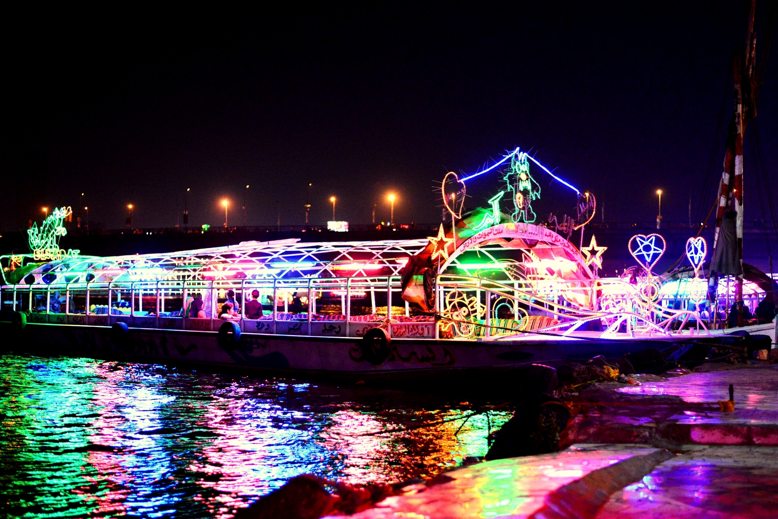Hearts, stars and teddybears are but a few of the neonlight decorations of the boats. (Photo by Aaron T. Rose)