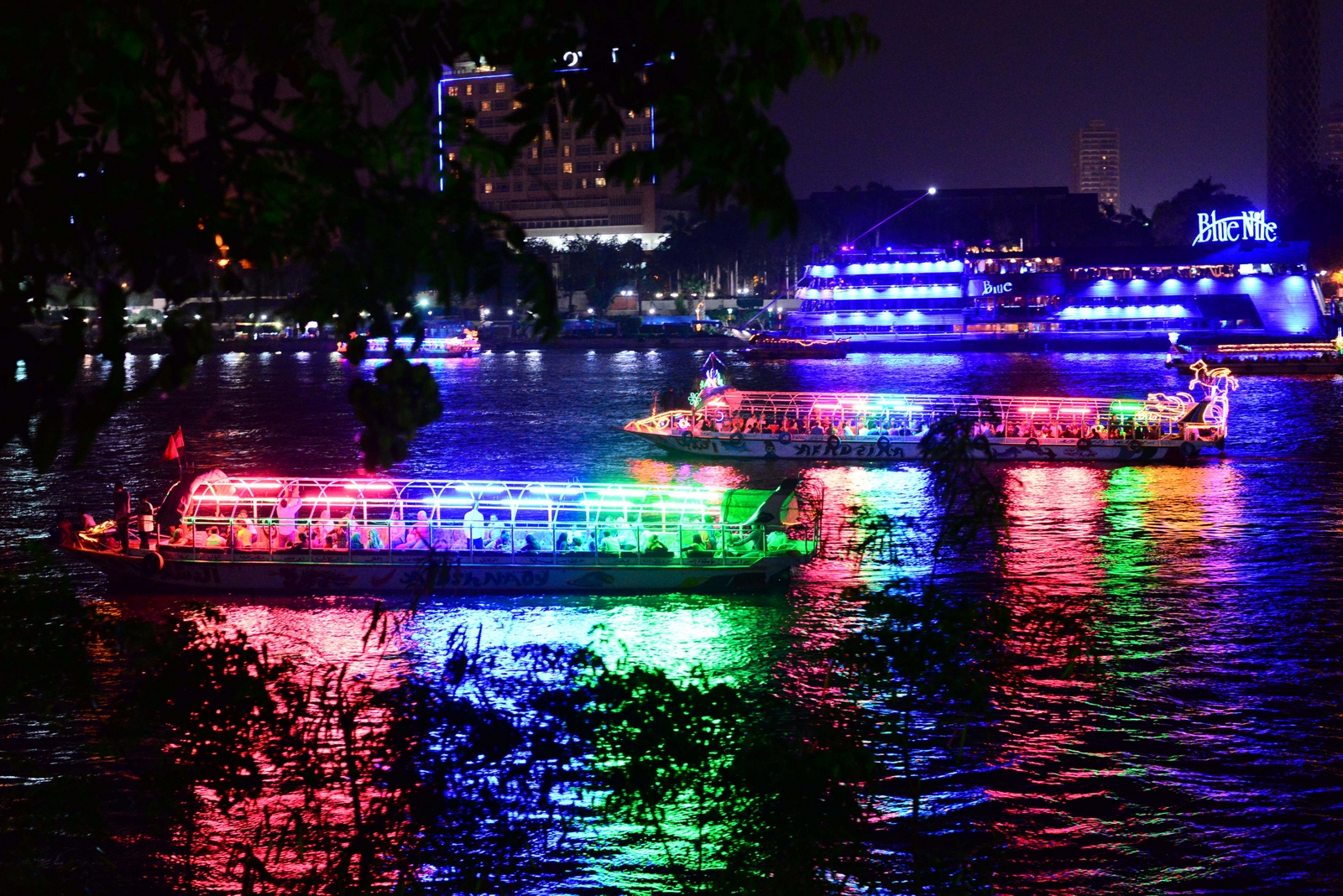 Green, blue and pink reflections turn the Nile into a riot of colours. (Photo by Aaron T. Rose)