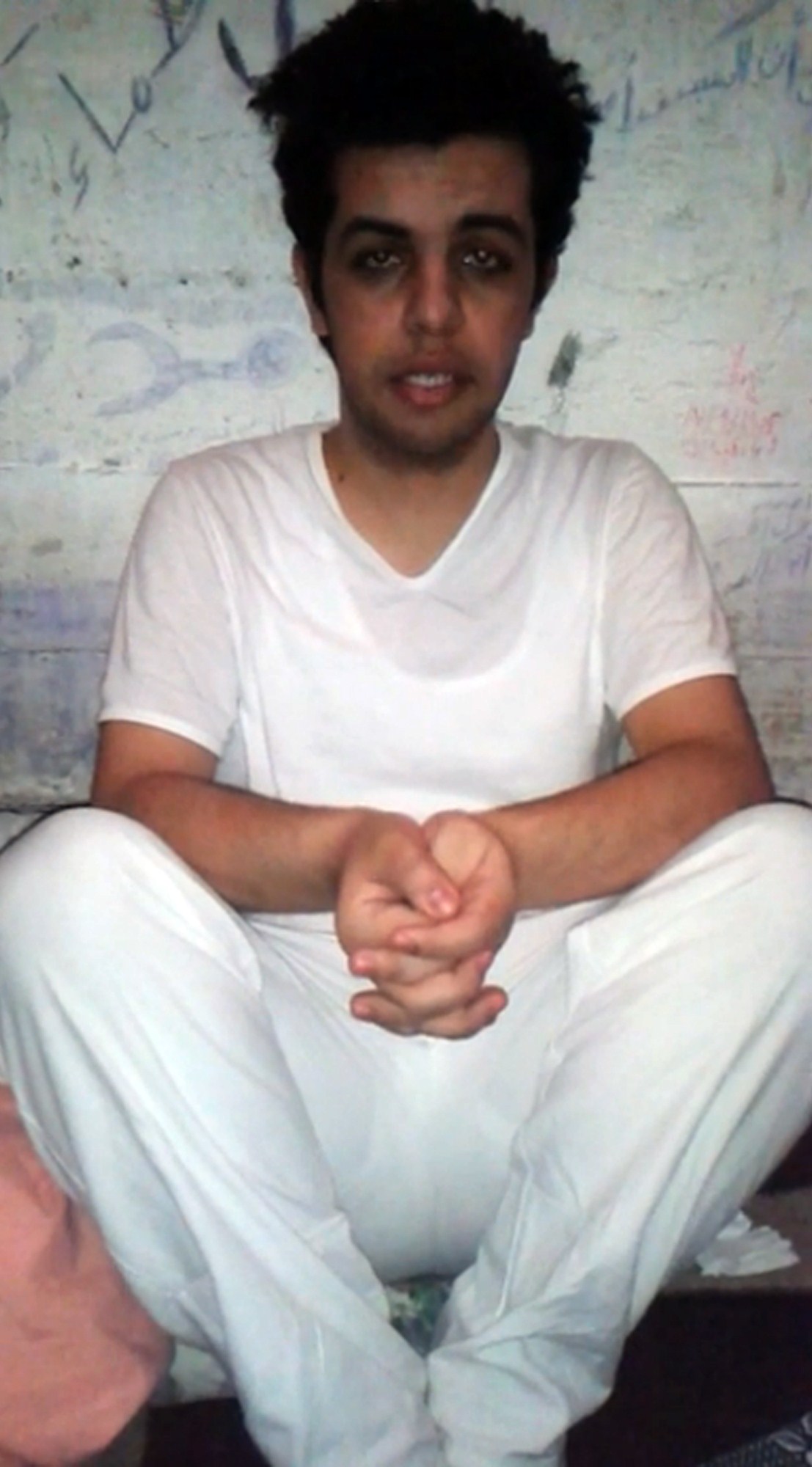 A grab taken from a video aired on the Qatari based Al-Jazeera Arabic news channel, shows the Al-Jazeera Arabic news correspondent Abdullah Elshamy speaking in a cell, on May 14, 2014. Elshamy was arrested August 14, 2013, when police dispersed supporters of ousted Islamist president Mohamed Morsi in Cairo, which led to clashes in which hundreds were killed. AFP PHOTO / HO/ AL-JAZEERA===RESTRICTED TO EDITORIAL USE - MANDATORY CREDIT "AFP PHOTO/HO/AL JAZEERA" - NO MARKETING NO ADVERTISING CAMPAIGNS - DISTRIBUTED AS A SERVICE TO CLIENTS==CAMPAIGNS - DISTRIBUTED AS A SERVICE TO CLIENTS